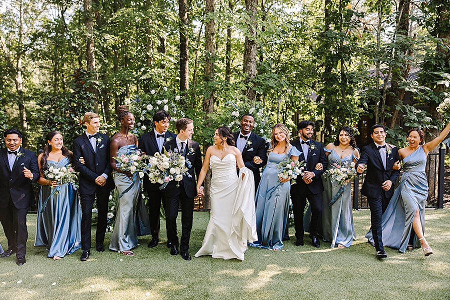 bridal party cheering after ceremony at Nichols Heir