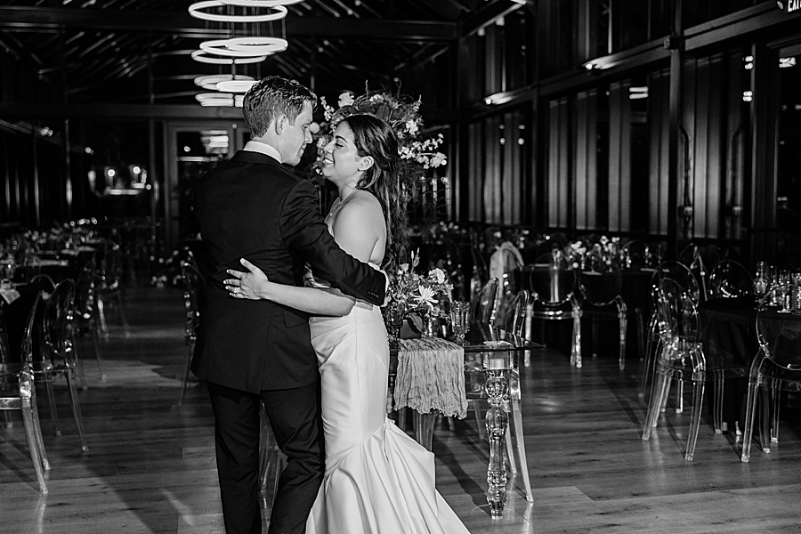 bride and groom sharing private last dance at glass house at Nichols Heir
